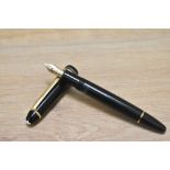 A Montblanc Meisterstuck 146 twist fill fountain pen in black with two narrow and a broad band to