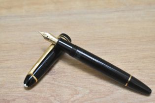 A Montblanc Meisterstuck 146 twist fill fountain pen in black with two narrow and a broad band to