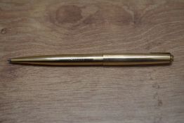 A Parker 65 Insignia ballpoint pen in gold fill. Engraved