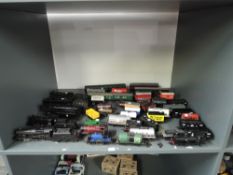 A shelf of playworn 00 gauge including Hornby 4-6-2 Vulcan, 4-6-0 Holyhead, Triang 4-6-0 4983, Wrenn