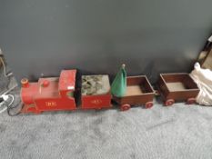 A wooden hand made Ride on Train with two Wagons, made for Christmas 1962, Train in red marked MR