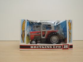 A Britains model, 9522 MF Massey Ferguson 595 Tractor, in original window display box with card