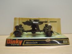 A Meccano Dinky die-cast, 656 88MM Gun, on bubble card display stand and appears unopened, slight