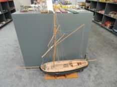 A wooden scale model of a Schooner on wooden stand, length 140cm, height 130cm