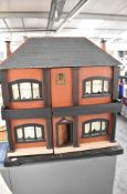 A 1930's wooden Two Storey Dolls House, 1:16 scale with opening roof, height 64cm, width 66cm