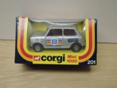 A 1970's Corgi die-cast, 201 Mini 1000, silver with multi coloured stripes, racing number 8 and Team