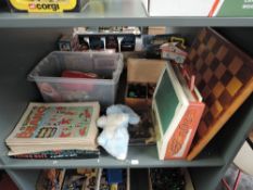 A shelf of mixed toys including two wooden Chess Sets with boards, Beano Comics, Flying Hats Game,