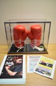 A pair of Boxing Gloves bearing signatures from T. Fury (Tyson Fury) with photograph provenance,