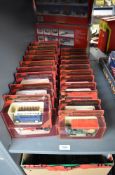 A collection of Matchbox Models of Yesteryear die-casts, Vintage Vans and Cars, all in red window