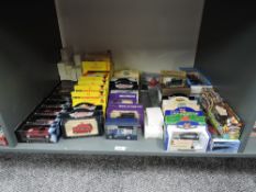 A shelf of modern die-casts including Shell Classico and Sportscar Collections, Vanguards etc, all