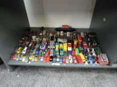 A shelf of modern playworn die-casts including Polistil Racing Cars, Models of Yesteryear, Schuco