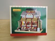 A 2016 Lemax Porcelain Lighted Building, Muir Farms, in original box, appears unused