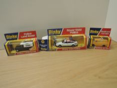 Three Dinky die-casts, 264 Rover 3500 Police, 277 Police Land-Rover and 412 Bedford AA Van, all on