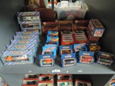 A shelf of Matchbox die-casts including Convoy x 8, 1981 Mini Ha Ha x2, 1990's and later, approx 24,