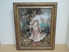 A decorative reproduction Shadow Box Doll having Tiffany Studio marking to front of case and