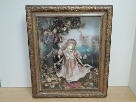 A decorative reproduction Shadow Box Doll having Tiffany Studio marking to front of case and