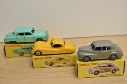 Three Dinky Die-casts, 157 Jaguar XK120 Coupe, yellow with yellow hubs, correct spot box missing one