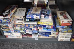 A shelf of mainly Military plastic kits, mainly Fighter Planes, Airfix, Italeri and similar in