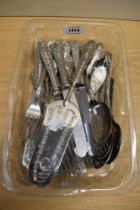 A collection of cutlery, having moulded handles.