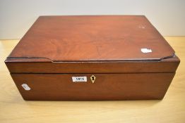 A mahogany box filled with as selection of mixed modern and vintage haberdashery.