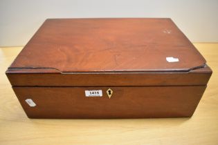 A mahogany box filled with as selection of mixed modern and vintage haberdashery.