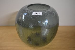 A 20th Century green art glass vase, with mottled and cracked design, measuring 20cm tall