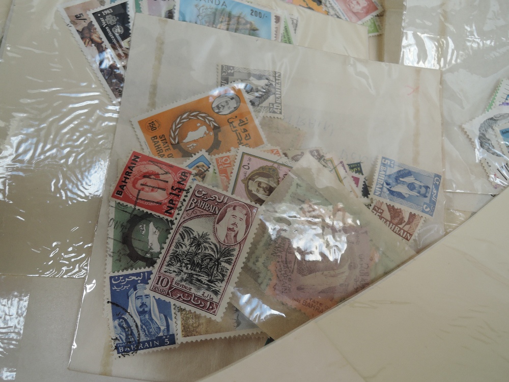 BOX WITH HUNDREDS OF BAGS OF OFF PAPER STAMPS, MINT AND USED Box of pure stamps in clear faced - Image 2 of 4