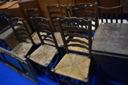 A set of six 19th century rush seated ladder back chairs