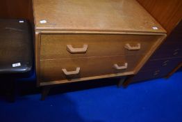 A vintage golden oak E Gomme (G Plan) two drawer bedroom chest