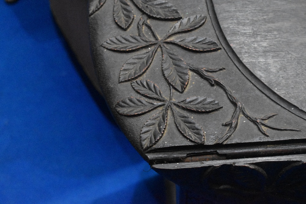 A 19th Century gateleg table having carved decoration, approx dimensions W114, D97, H76cm - Image 2 of 2