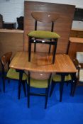 A vintage teak extending dining table and set of four designer dining chairs, table approx 107cm,