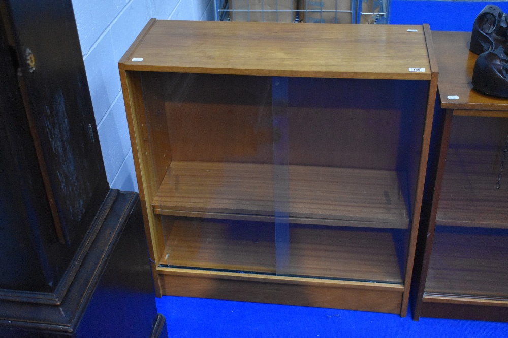 A vintage teak effect low bookcase, width approx 76cm (H79 D30)