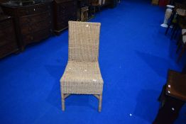 A modern wicker conservatory dining chair