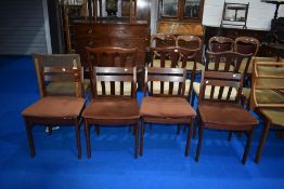 A set of four vintage teak designer low back dining chairs, possibly G plan or similar