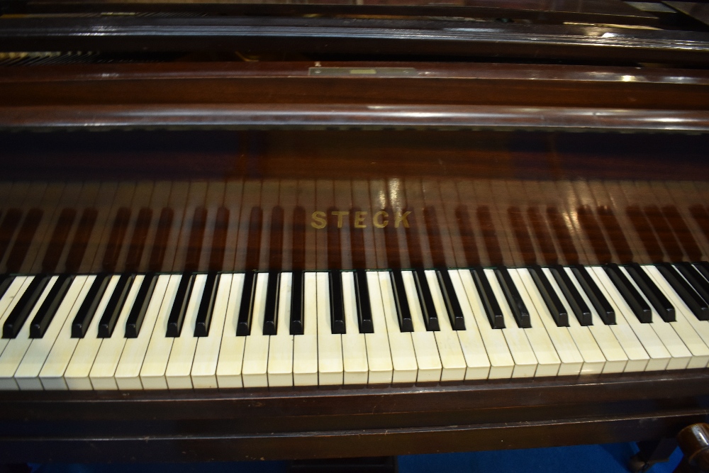 An early 20th Century mahogany cased baby grand piano by Steck having metal overstrung frame, - Image 2 of 5