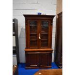 A Victorian mahogany bookcase having frieze drawer and double cupboard to base, dimensions approx.