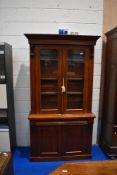 A Victorian mahogany bookcase having frieze drawer and double cupboard to base, dimensions approx.