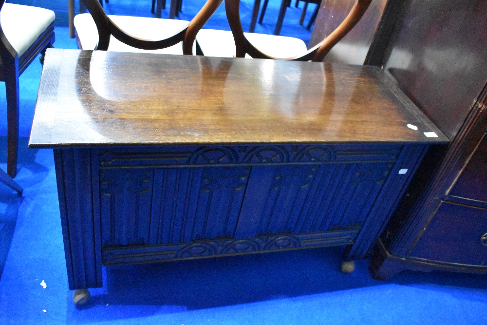 A mid 20th century oak blanket box having linen fold decoration to front panels, dimensions approx