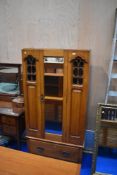 A Victorian wardobe, missing top cornice, fretwork to glass panels, height approx 184cm