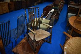 A late 19th or early 20th Century rush seated rocking chair of small proportions, width approx