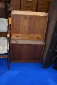 A vintage teak bureau of small proportions, approx dimensions W61 D36 H98cm