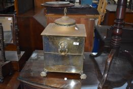 A traditional brass coal bucket