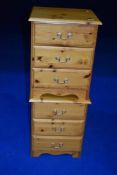 A pair of modern pine bedside chests of three drawers, each approx W44 D39 H57cm