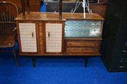 A vintage sideboard of interesting design with vinyl padded doors, width approx 141cm