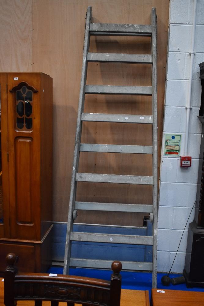 A large vintage decorators ladder of wide proportions