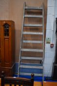 A large vintage decorators ladder of wide proportions