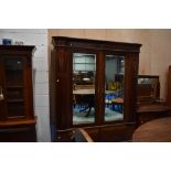 An Edwardian mahogany two piece bedroom suite comprising mirror door wardobe and dressing table,