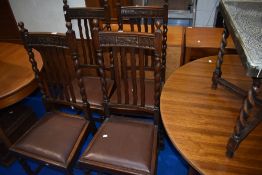 A set of four early 20th Century wave back dining chairs