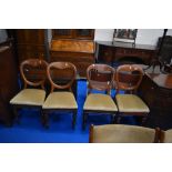 A set of four Victorian mahogany balloon back dining chairs