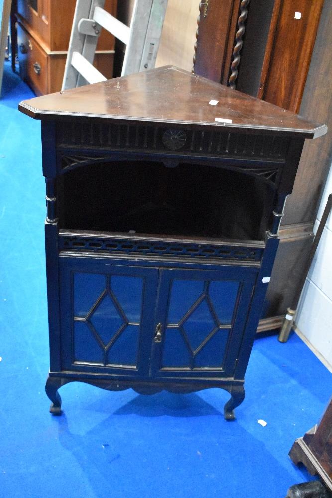 A late 19th or early 20th Century corner cabinet base